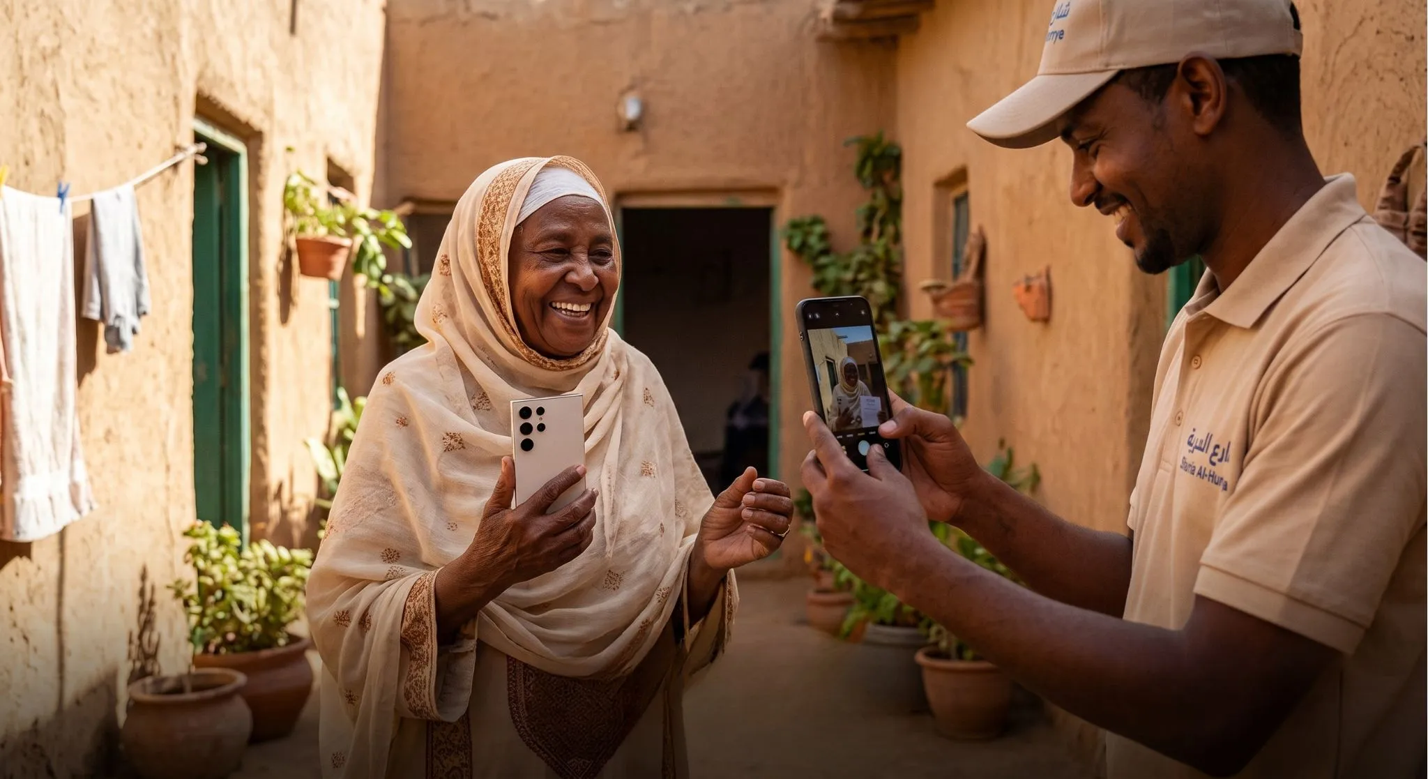 A new Samsung phone handed to a family member at their home in Sudan